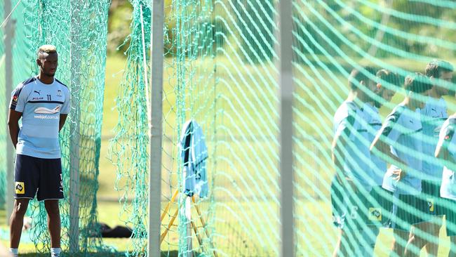 Injured Sydney FC winger Bernie Ibini watches on a training this week.