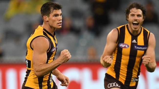 Jaeger O’Meara kicks a goal against Melbourne to the delight og teammate Liam Shiels. Picture: AAP