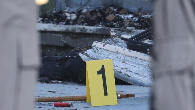 Police marked items around the Newtown building on Tuesday. Picture: John Grainger