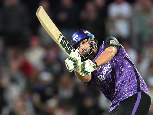 HOBART, AUSTRALIA - JANUARY 14: Tim David of the Hurricanes hits a six during the BBL match between the Hobart Hurricanes and Melbourne Renegades at Blundstone Arena, on January 14, 2025, in Hobart, Australia. (Photo by Steve Bell/Getty Images)