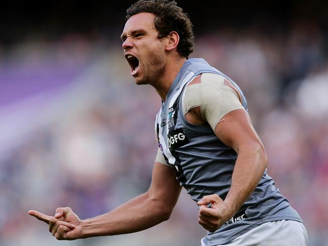 PERTH, AUSTRALIA - JUNE 15: Steven Motlop of the Power celebrates after scoring a goal during the round 13 AFL match between the Fremantle Dockers and the Port Adelaide Power at Optus Stadium on June 15, 2019 in Perth, Australia. (Photo by Will Russell/AFL Photos/via Getty Images )