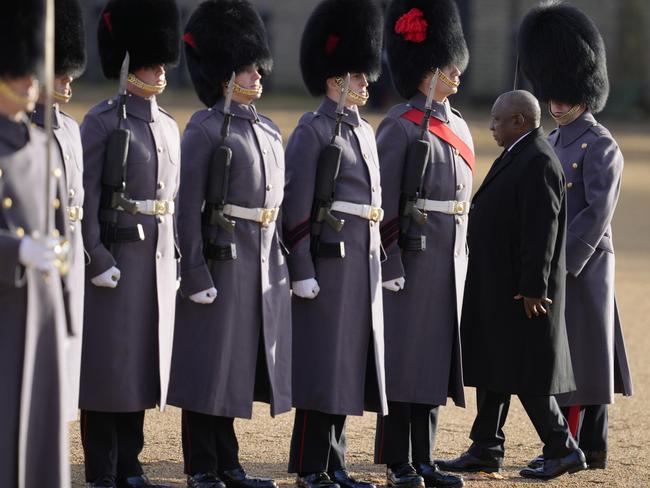 President of South Africa Cyril Ramaphosa walks through soldiers at a ceremonial welcome at Horse Guards Parade. Picture: Getty Images.