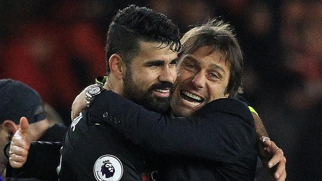 Chelsea's Italian head coach Antonio Conte (R) reacts as he congratulates Costa.