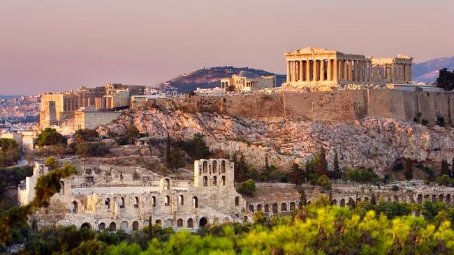 Sunrise over the Acropolis citadel in Athens.