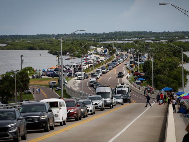 People leave after learning the second launch of the Artemis I unmanned lunar rocket was postponed, in Titusville, Florida. Picture: Marco Bello/AFP