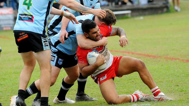 Richard Roberts held in a tackle. Picture: Leigh Jensen