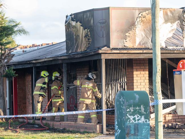 The building was fully involved in fire and multiple explosions were heard. Picture: Tony Gough
