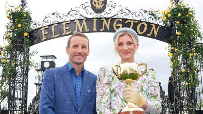 Star jockeys Damien Oliver and Jamie Kah pose with the Melbourne Cup. (Photo by Scott Barbour/Racing Photos via Getty Images)