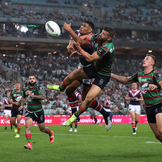 Daniel Tupou of the Roosters and Josh Mansour of the Rabbitohs compete for the ball. Picture: Cameron Spencer/Getty Images