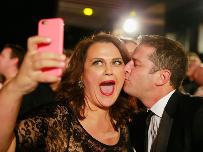 Karl Stefanovic kisses Chrissie Swan as she takes a selfie at the 2015 Annual Logie Awards. Picture: Getty