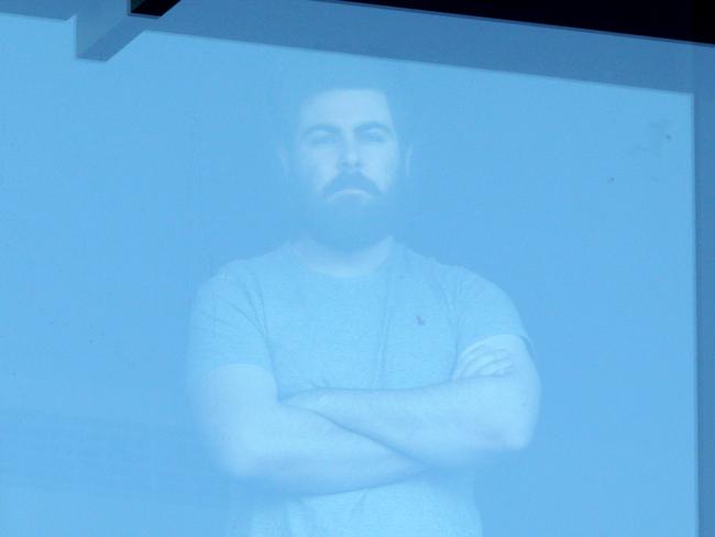 Jack O'Brien, lives in Ashgrove, at the window of his Covid Hotel, Novotel Brisbane Airport, Eagle Farm Brisbane, on Wednesday 30th June 2021, Photo Steve Pohlner