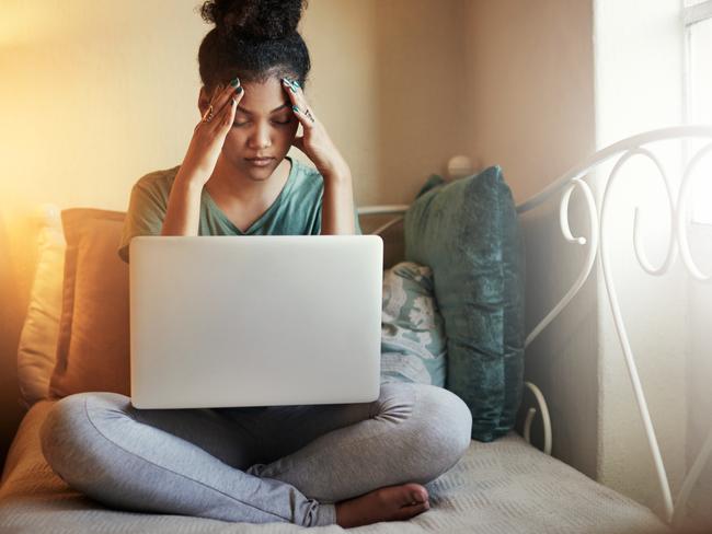 Full length shot of a young female student studying at home