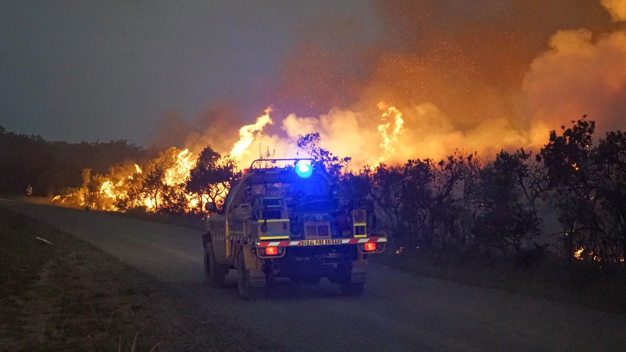 If bushfires like that seen in Deepwater National Park hit the southeast, road closures could cause chaos. Picture: AFP/Rob Griffith