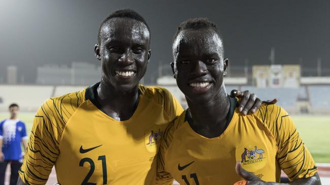 Socceroo players Thomas Deng and Awer Mabil shortly after the win over Kuwait