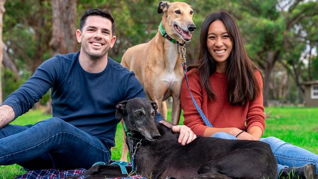 Matt Woods and partner Karmen Fong with Millie (front) and Diesel (back). Picture: Dr Keefe Tay of Furry Munchkins Photography