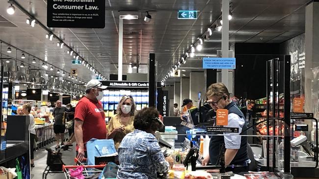 People wearing masks at Aldi in Marion.