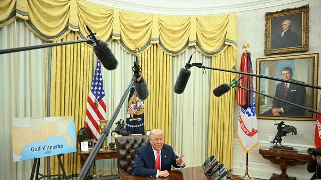 Donald Trump has decked out the inner sanctum of the US presidency with gilt trophies and gold-plated, Trump-branded coasters, and filled almost every available inch of wall space with portraits of his predecessors. Picture: AFP