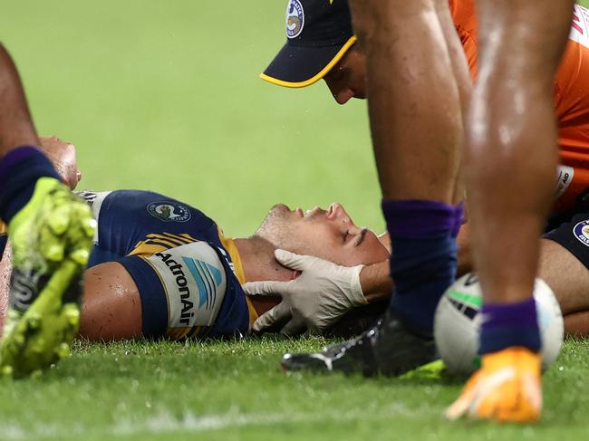 SYDNEY, AUSTRALIA - MARCH 18:  Ryan Matterson of the Eels is attended to by a team trainer after a head knock during the round two NRL match between the Parramatta Eels and the Melbourne Storm at Bankwest Stadium on March 18, 2021, in Sydney, Australia. (Photo by Cameron Spencer/Getty Images)