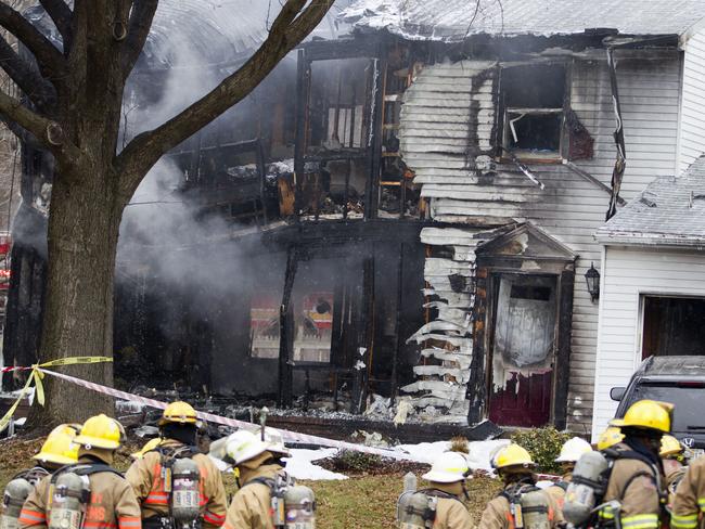 A private jet plane crashed into the family home in Maryland. (AP Photo/Jose Luis Magana)