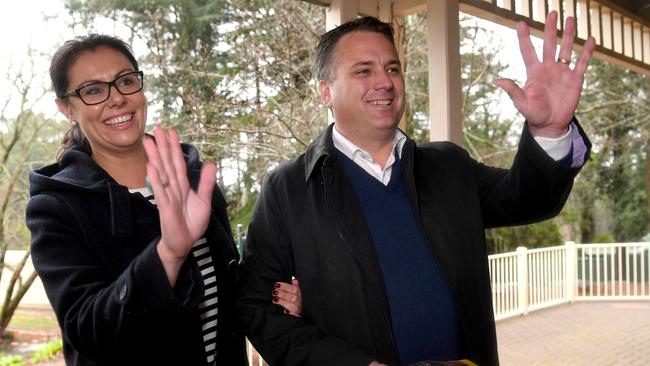 Sitting member Jamie Briggs arriving to vote with his wife Estee Fiebiger. Picture: Tricia Watkinson