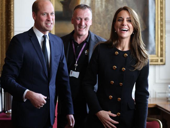 Prince William and Kate Middleton share a lighter moment as they visit the Guildhall in Windsor to thank volunteers and staff who worked on the funeral of Britain's Queen Elizabeth II. Picture: AFP