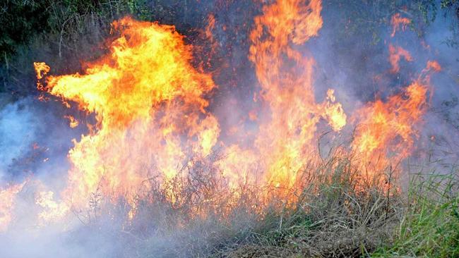 A storm is crossing the region but fire fighters are on the scene of a grassfire at Bells Bridge. Picture: Warren Lynam