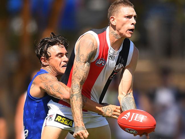 Matthew Parker feeds off a handball under pressure.