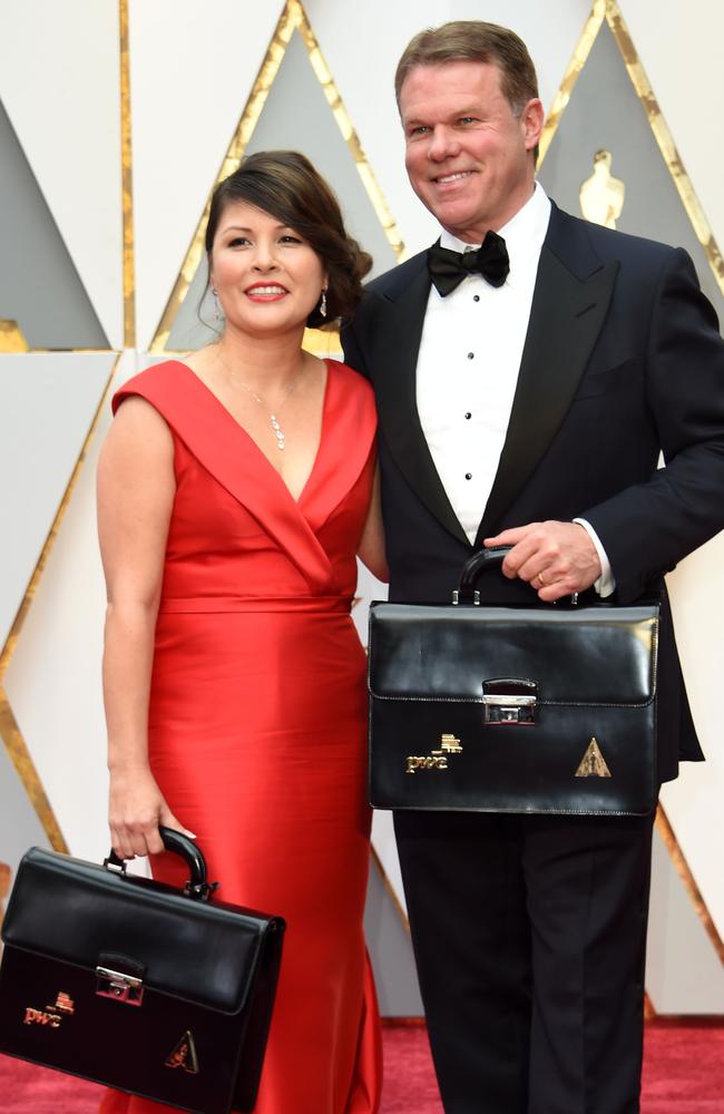 PriceWaterhouseCooper representatives Martha L. Ruiz and Brian Cullinan on the red carpet at the start of the ceremony. Picture: AFP