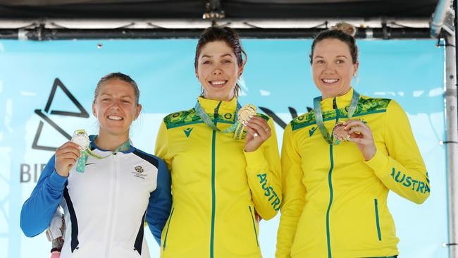 Australia’s Georgia Baker (C) and Sarah Roy celebrate gold and bronze respectively after the women’s road race at the 2022 Games. Picture: Getty