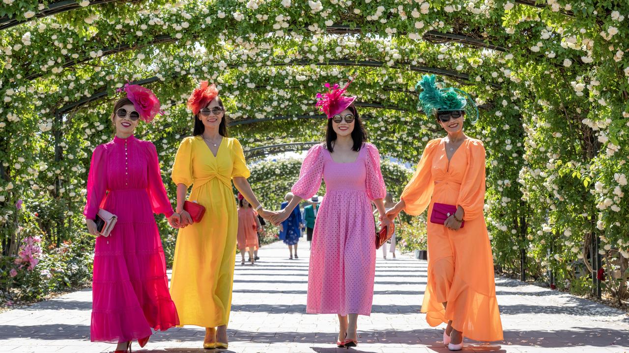 A group of friends wore similar dresses in different colours. Picture: Jay Town/Racing Photos via Getty Images