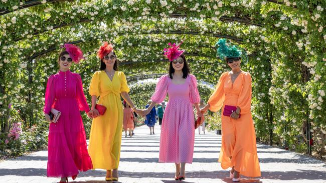 A group of friends wore similar dresses in different colours. Picture: Jay Town/Racing Photos via Getty Images