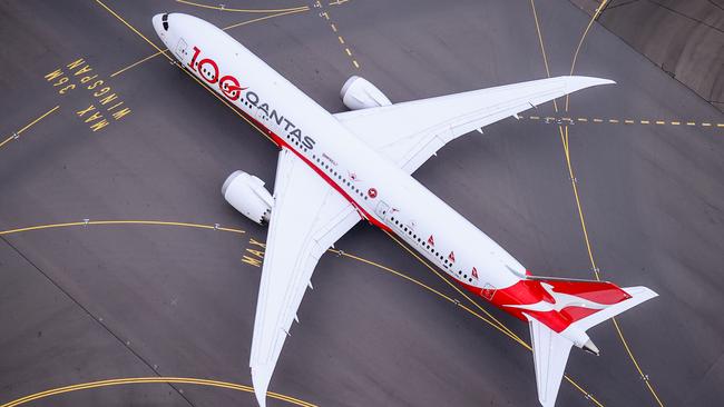 SYDNEY, AUSTRALIA - NOVEMBER 16: A Boeing 787 Dreamliner aircraft, Qantas flight QF100 prepares to take off from Kingsford Smith International airport as part of Qantas 100th Birthday celebrations on November 16, 2020 in Sydney, Australia. Australia's national airline Qantas is celebrating 100 years. (Photo by David Gray#JM/Getty Images for Destination New South Wales/Qantas)