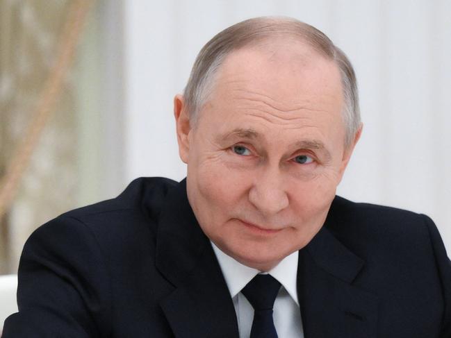 In this pool photograph distributed by the Russian state agency Sputnik, Russia's President Vladimir Putin meets with young scientists following an awards ceremony at the Kremlin in Moscow on February 6, 2025.  (Photo by Kristina Kormilitsyna / POOL / AFP)