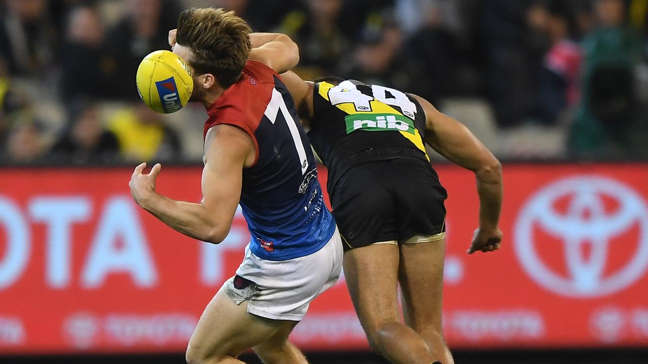 Jack Viney is collected by Sydney Stack at the start of the fourth quarter on Wednesday night. (AAP Image/Julian Smith)