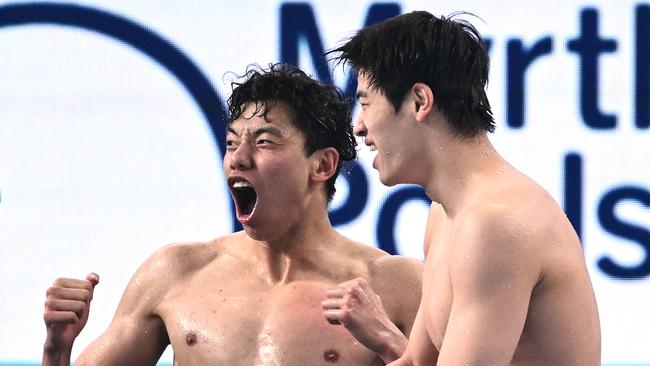 Xinjie Ji and Zhanle Pan celebrate during the Men's 4x100m Freestyle Final. Picture: Getty