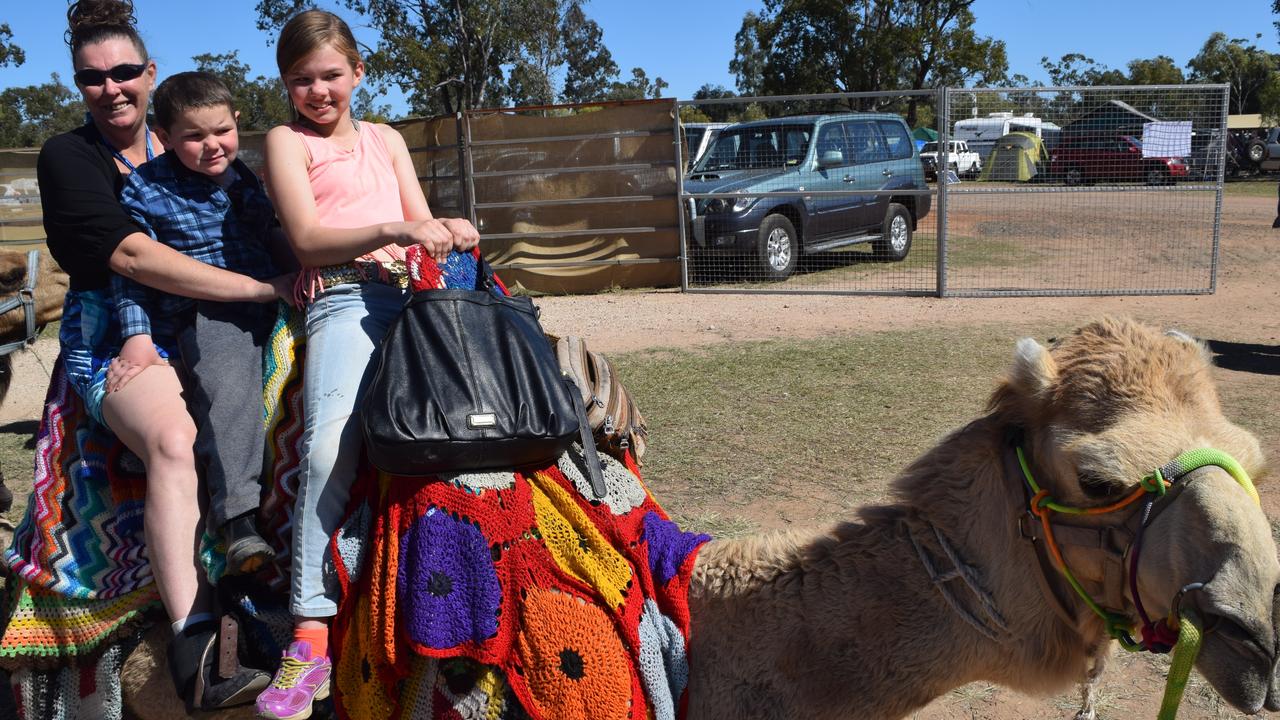 Chaseley, Rodney and Emily Gibbons tries out the camel rides at the Tara Festival of Culture and Camel Races. Photo Elouise Quinlivan / Dalby Herald.