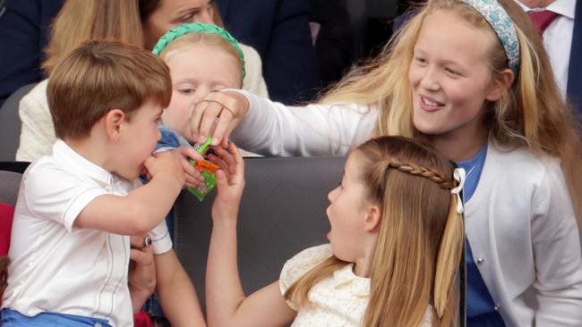 Prince Charlotte was all business … until there were snacks around. (Photo by Chris Jackson – WPA Pool/Getty Images)