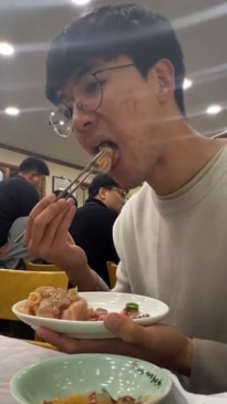 Man eats chicken sashimi