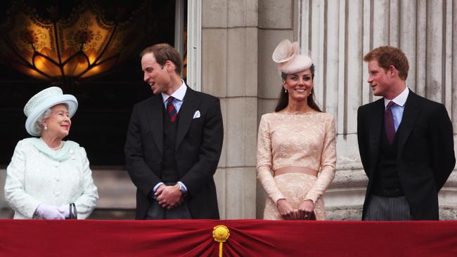 Queen Elizabeth with Prince William, Catherine, Duchess of Cambridge and Prince Harry wave to the crowds from Buckingham Palace during the Diamond Jubilee carriage processionin 2012. Picture: Getty Images.