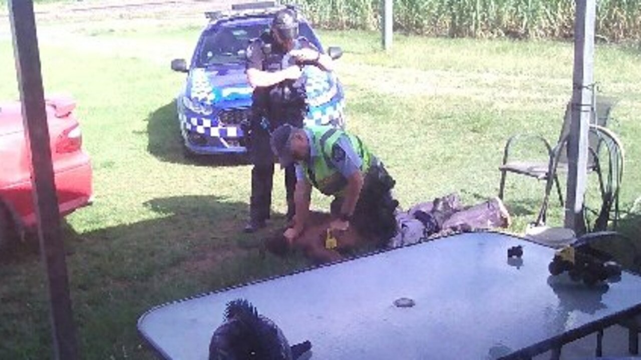 The moment when Queensland Police arrested Brian Tapim on the front porch of an Oakenden property.