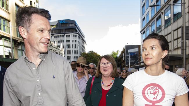 NSW Premier Chris Minns pictured marching with family at The 