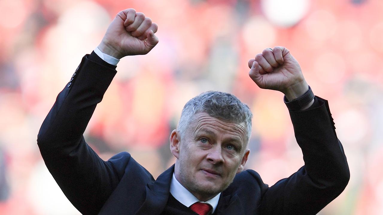 Manchester United's Norwegian manager Ole Gunnar Solskjaer applauds the fans