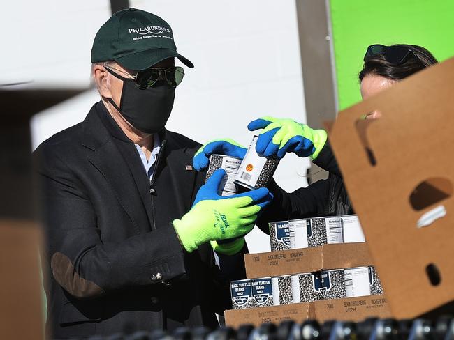 US President-elect Joe Biden helps volunteers fill food donation boxes at the Philabundance food bank during the Martin Luther King National Day of Service. Picture: AFP