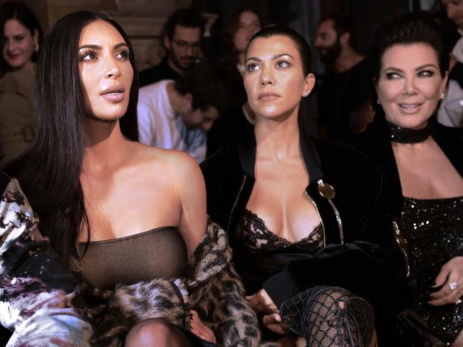 Kim Kardashian, Kourtney Kardashian and Kris Jenner sit front row at Paris Fashion Week. Picture: ADP/Alain Jocard