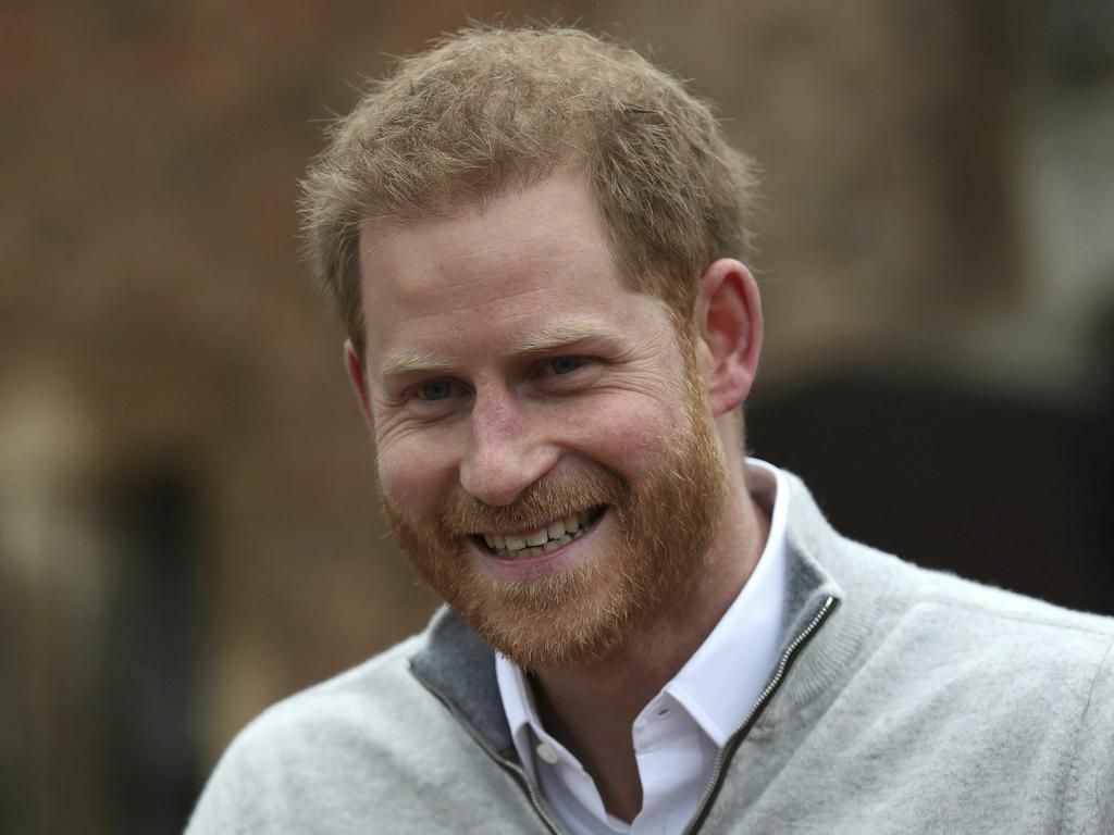 An excited Prince Harry speaks to the media outside Windsor Castle after the arrival of his baby son. Picture: AP