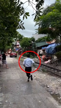 Man parks his car in the way of a freight train