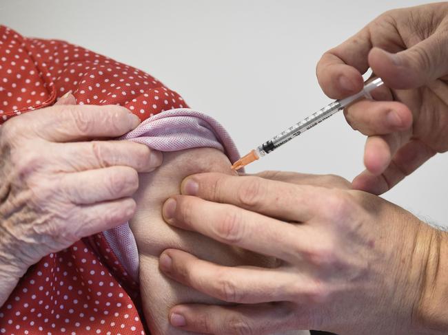 A resident of a retirement home in France receives a dose of the Pfizer/BioNtech COVID-19 vaccine, as the country starts its national vaccination campaign. Picture: AFP