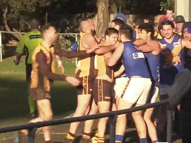 Former AFL umpire Michael Pell headbutted in a local footy game.