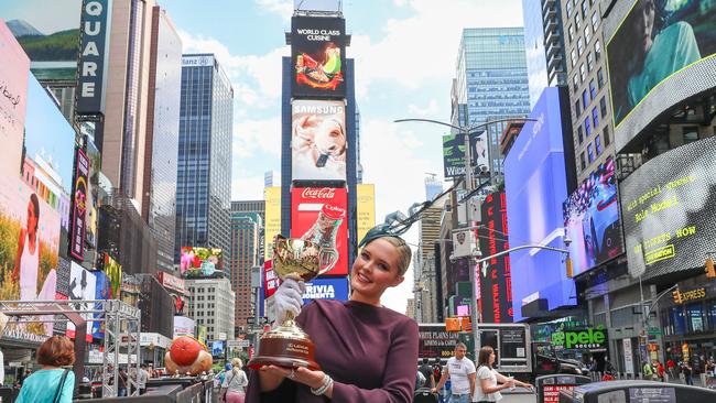 The Melbourne Cup trophy has visited model Georgina Burke in New York, to celebrate the fact Fashions on the Field is again going global.