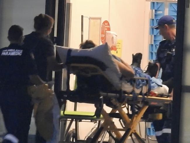 An officer from the Mid North Coast Correctional Centre arrives at Port Macquarie base hospital after being held hostage for 5 hours by an armed inmate , Picture by Nathan Edwards